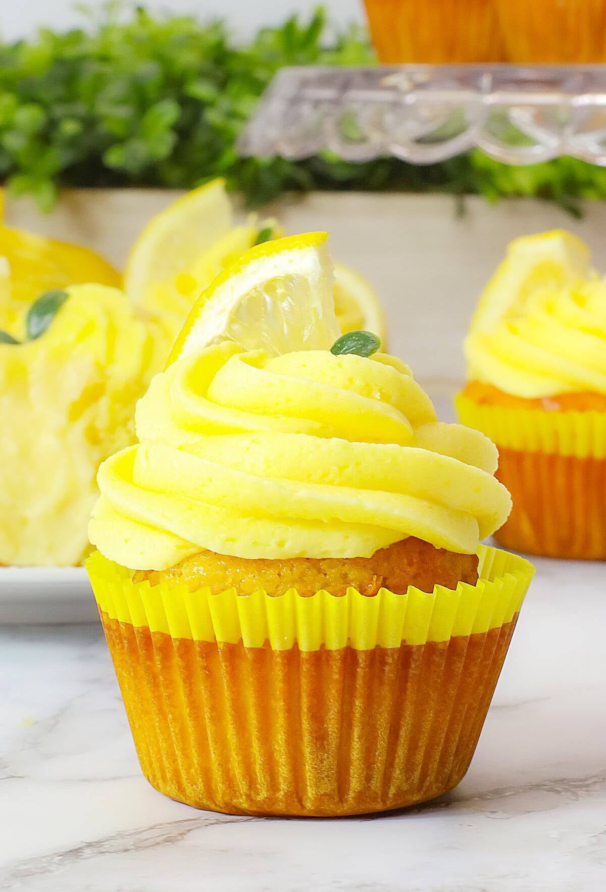 Cheesecake Stuffed Lemon Cupcakes with Lemon Frosting